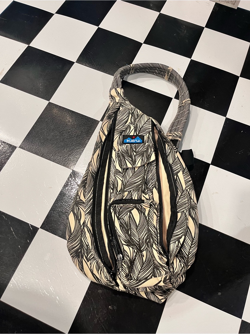 Kavu Leaf-Print Sling Bag in Black and Cream